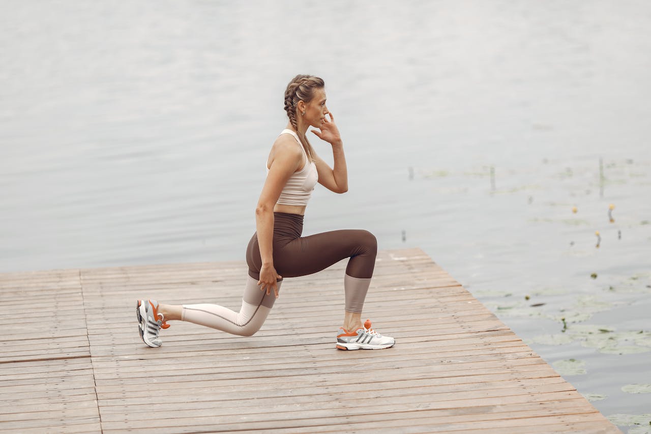 A woman doing lunges outdoor