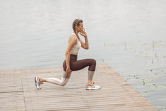 A woman doing lunges outdoor