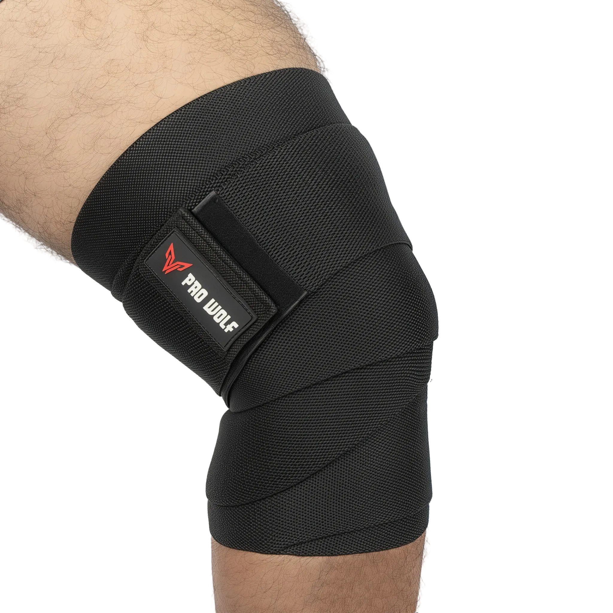 A black knee support brace wrapped around a person's knee, featuring a hook-and-loop strap with the red and white 'PRO WOLF' logo, shown against a plain white background.
