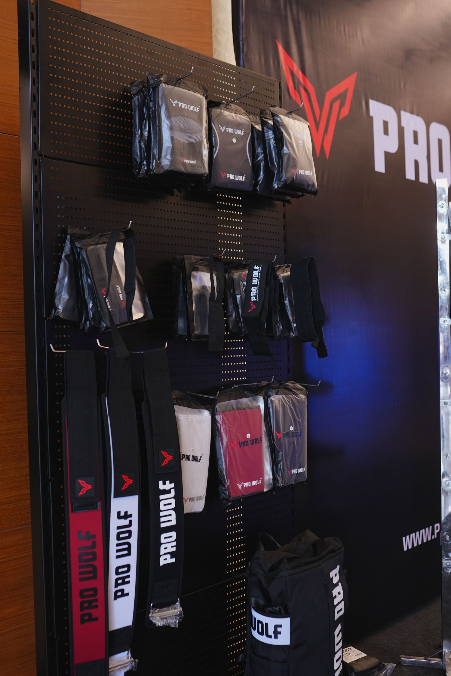 Display of Pro Wolf products on a wall with branding visible.